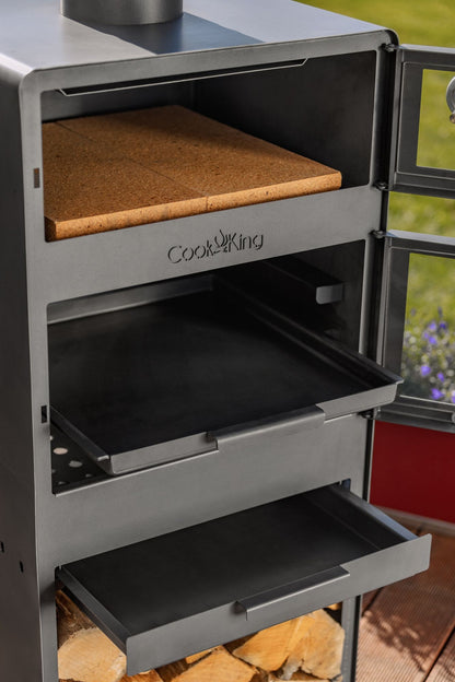 Cook King – Pack VENTO – Brasero cheminée avec four, grille de cuisson et range-bûches — mise en situation