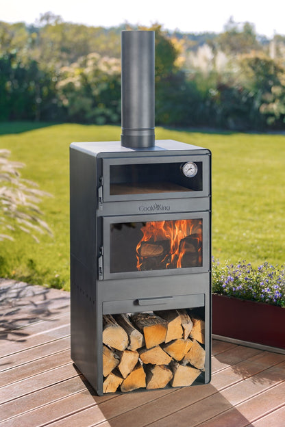 Cook King – Pack VENTO – Brasero cheminée avec four, grille de cuisson et range-bûches — mise en situation